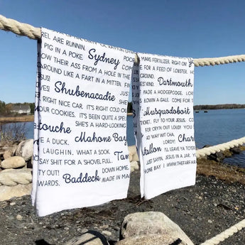 White decorative kitchen towels with black script from Anne MacDonald in 2023 Best Sellers collection
